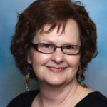 Head shot of Murder Mystery Author Rue Elliott